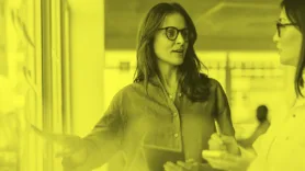 two people discussing learning objectives and performance objectives for an LMS