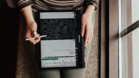 Person working on a tablet, as seen from above