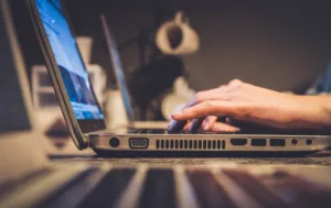 hands typing on a keyboard